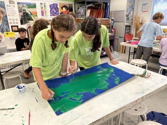 Middle School students painting world map