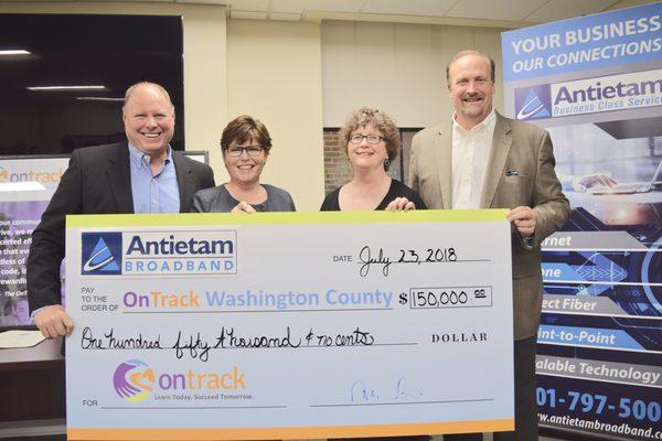 Managers at Antietam presenting $50,000 to OnTrack Washington County.