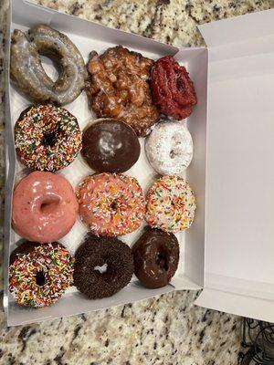 Red velvet, apple fritter, blueberry, Boston cream, powdered, strawberry glazed, sprinkled.