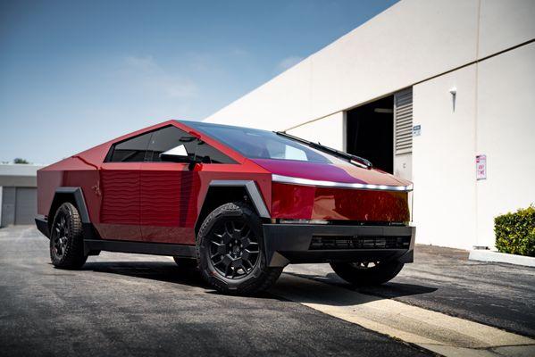 Tesla Cybertruck wrapped in Essmo Dragon Blood Red vinyl