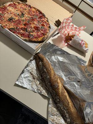 Cheesesteak, pizza, and fries