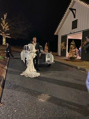 Couple getting ready for their get away in a vintage vehicle.