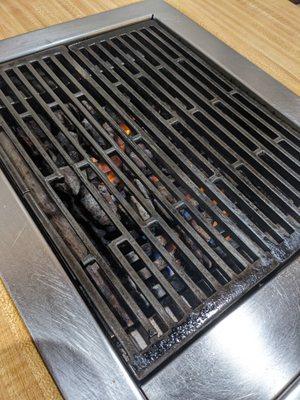 Grill with charcoals