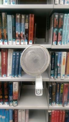 Cool shelf fans clipped to bookcases while you search for a favorite book. These are distributed throughout the library. Clever!