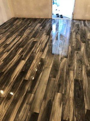 Shiny wood planks tile installation