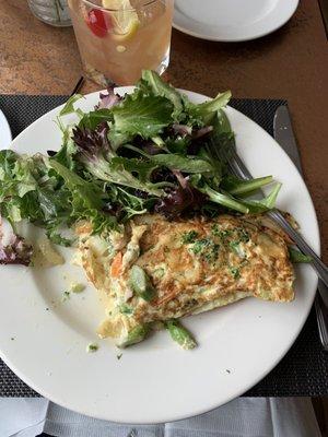 Vegetable omelette with asparagus, broccoli, carrots, multiple cheeses, onion, delicious salad as well.