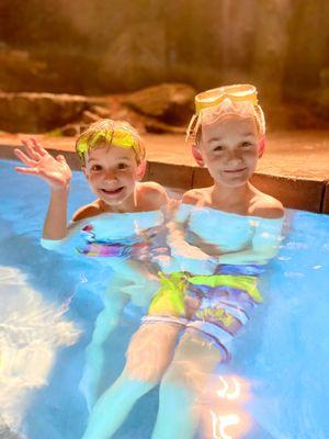 Boys enjoying the outdoor pool in the winter