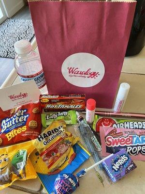 The amazing goodie bag you get after your wax! It has candy, lip balm, hand sanitizer, a fun pen etc!!! Love this idea , so fun!