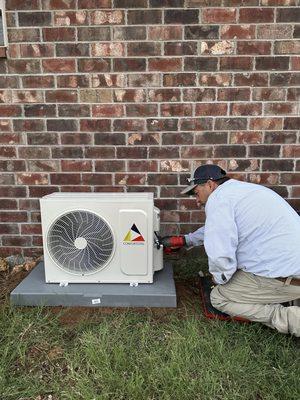 Technician finishing up a system.