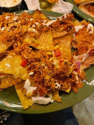 Dry, unacceptable chicken nachos.