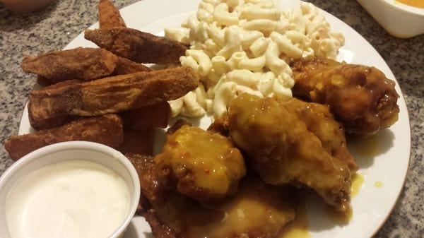 Wings,  mac salad, and potato wedges.