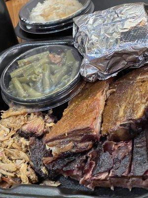 3 meat sampler combo that included 1/4 lb pulled pork, 1/4 lb brisket, 2 bone spare ribs, green beans, and seasonal baked potatoes.