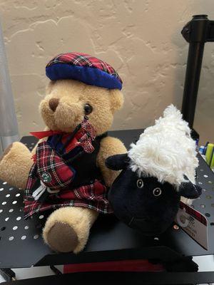 Bear with a bag pipe that plays music & Scottish sheep