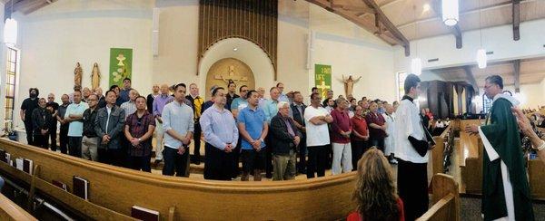 Father Geoffrey praying for all dads on Sunday at Fathers Day. Blessed my husband, son, and grandson were at the alter.