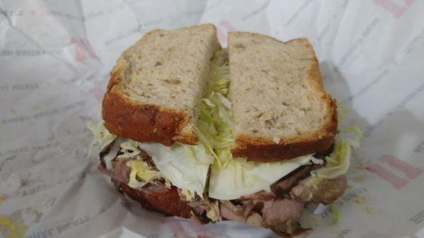 the hunters Club on sliced wheat bread double roast beef provolone cheese lettuce tomato.. no mayo add Dijon mustard