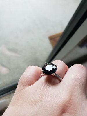 Black sapphire, while gold, and diamond engagement ring.