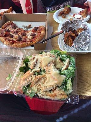 Medium pepperoni and sausage pizza chicken Caesar salad and chicken wings