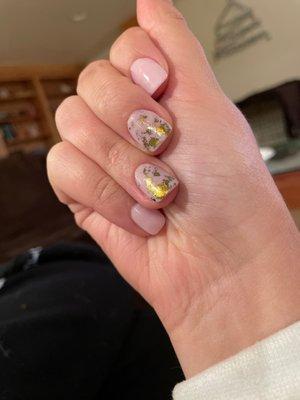 Nude nails with abstract gold flakes