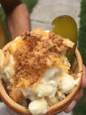 Mac N Cheese in a cone with pickle! Fried onions on top.