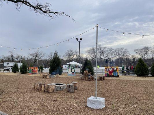 Fire pits next to the rink.