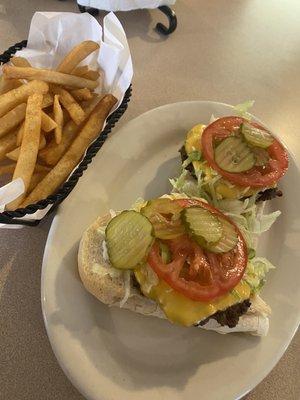 Open face cheeseburger Po Boy and fries.