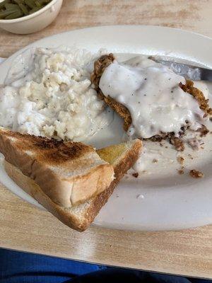 Chicken fried steak and mashed potatoes.