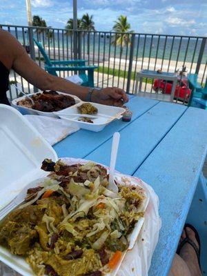 ! We took it to the beach ! Felt like we were in the islands - I had the jerk chicken and curry and hubby had oxtail!