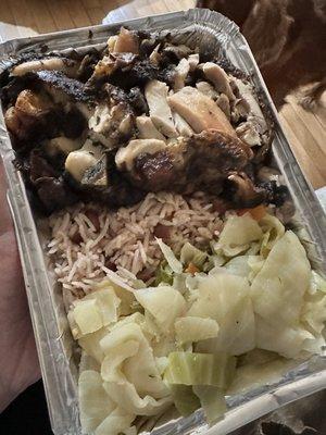 Jerk Chicken Favorite with rice and beans and cabbage.