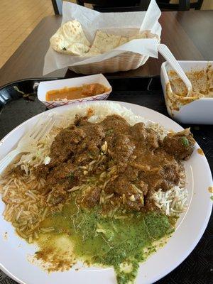 Goat curry with mint chutney.  Delicious garlic naan too.