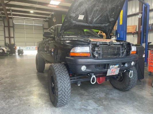 Upgraded Dodge Dakota being visually inspected