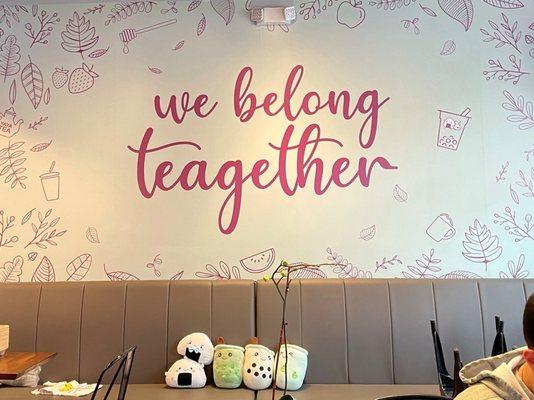 "we belong teagether" on the wall