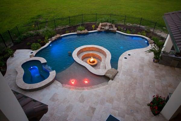 Custom Pool/Spa combo, waterfall, pool bar and fire pit.