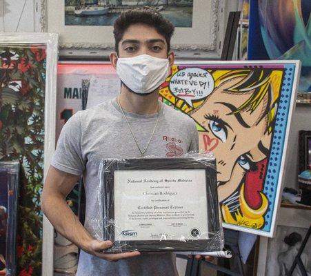 Customer Picking up framed Diploma