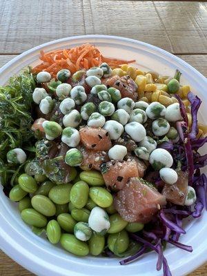 Bowl with 1/2 salmon, 1/2 tuna, ponzu sauce, veggies, wasabi peas, furikake, and 1/2 red rice + 1/2 greens as base