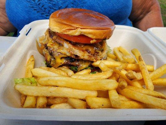 Loaded double cheeseburger with fries.