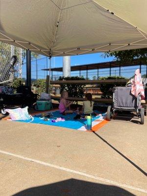 Little ones chilling during game. Yes we shared the tent for the little kids!