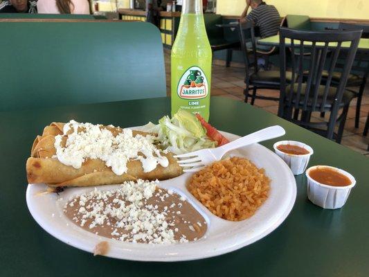 Flautas meal with lime Jarritos.