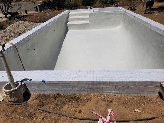 White plaster and white tile