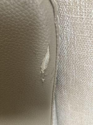 Side of leather sofa rip