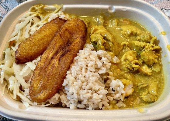 Curry chicken with brown rice, plantains, and veggies.