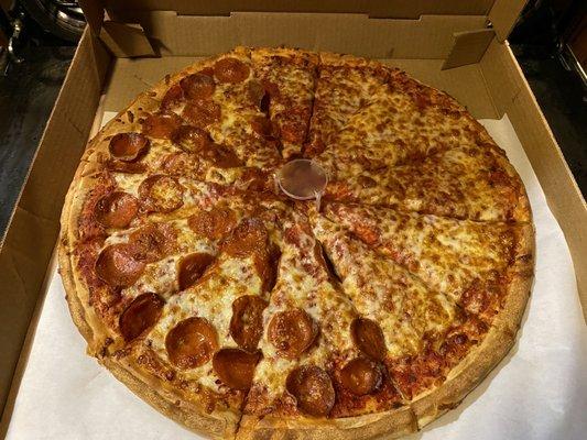 Large pizza with half pepperoni