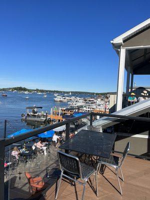 Upstairs on west side open air patio! Perfect location for a late afternoon, "had enough sun for the day", sipping and snacking rest!