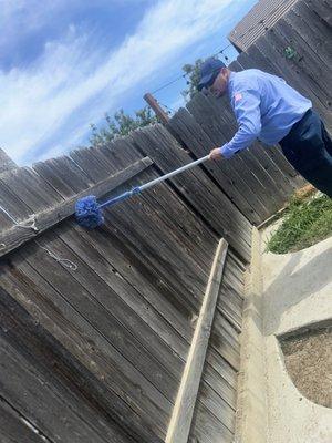 Keeping the webs off your fence line!