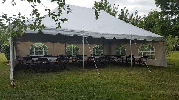 20x30 canopy pole tent set up in grass