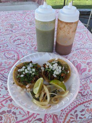 Barbacoa (left) and al pastor (right) tacos