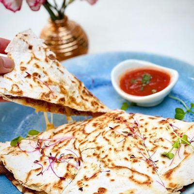 Quesadilla served with guacamole and spicy sauce