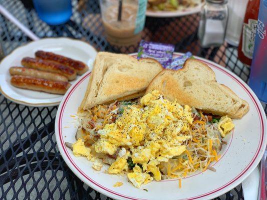 Custom order. Eggs, spinach, mushrooms, chopped bacon, cheese, home fries.