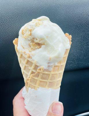 Banana pudding ice cream in a waffle cone.