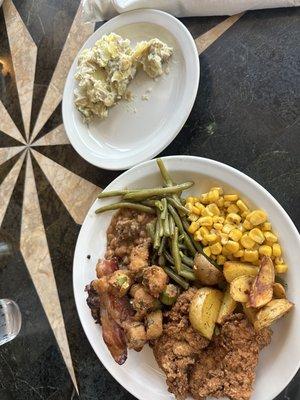 Chicken strips, corn, potato, potato salad, green beans and okra.