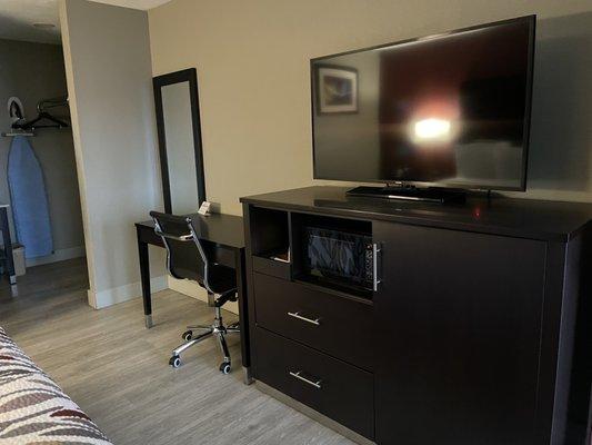 Good size flat screen TV, small microwave, nice size fridge/freezer inside update furniture unit.